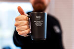 huum-black-mug-in-mans-hand_1 HUUM Mug